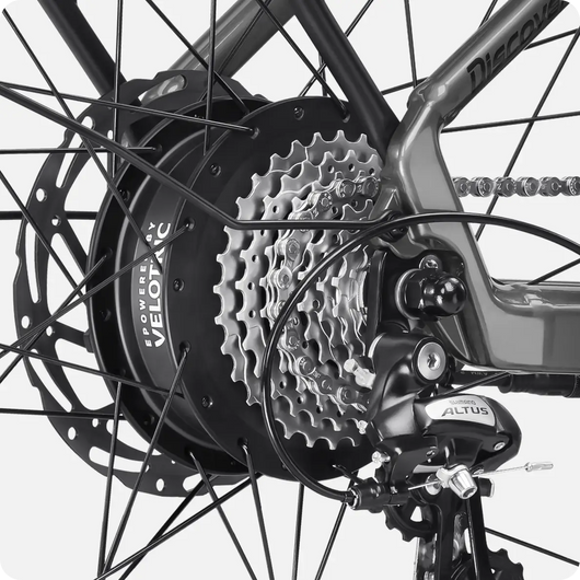 Close-up of a Velotric Discover 2's rear wheel hub and gear cassette with derailleur.