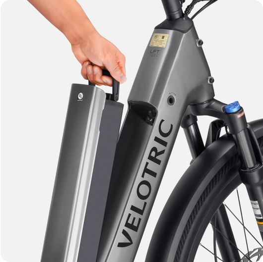 Person removing the battery from a Velotric Discover 2 eBike.