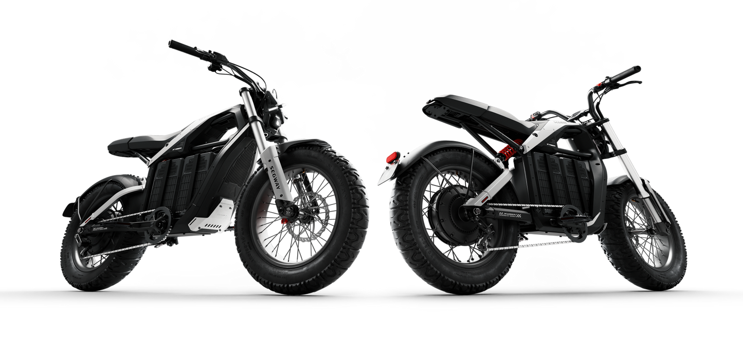 Two Segway Xyber Electric Bikes, in black and white, are showcased against a dark background. Featuring thick tires and a minimalist design from various angles, they're ideal for high-performance eBike enthusiasts seeking adventures around Tampa Bay.