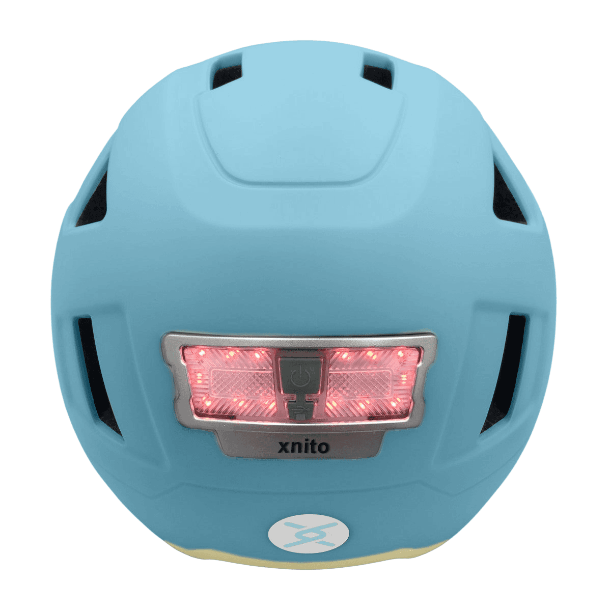 The XNITO Helmet XNITO - Old School - Sky features a red LED light at the back, ventilation slits for comfort, and elegantly displays the brand name "XNITO" below the light, blending style with safety.