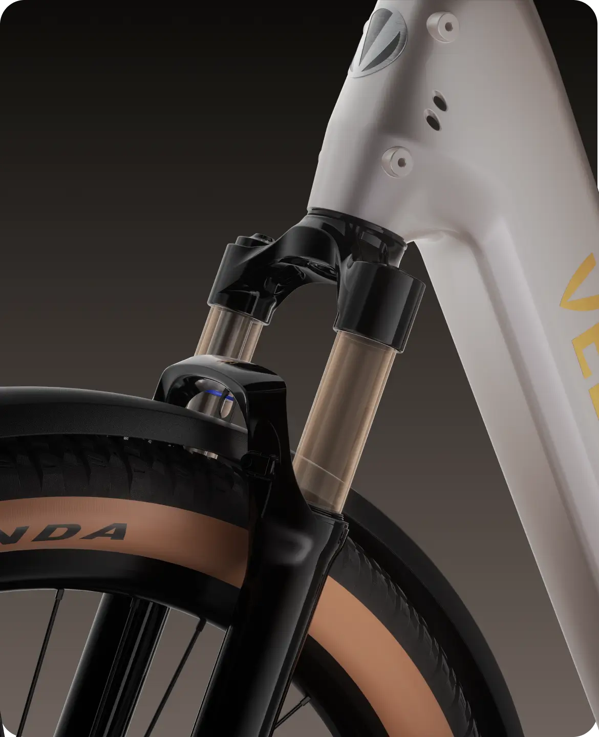 Close-up of the Velotric Discover M front suspension fork and tan sidewall tire, showcasing the Velotric comfort commuter eBike design against a gradient background.