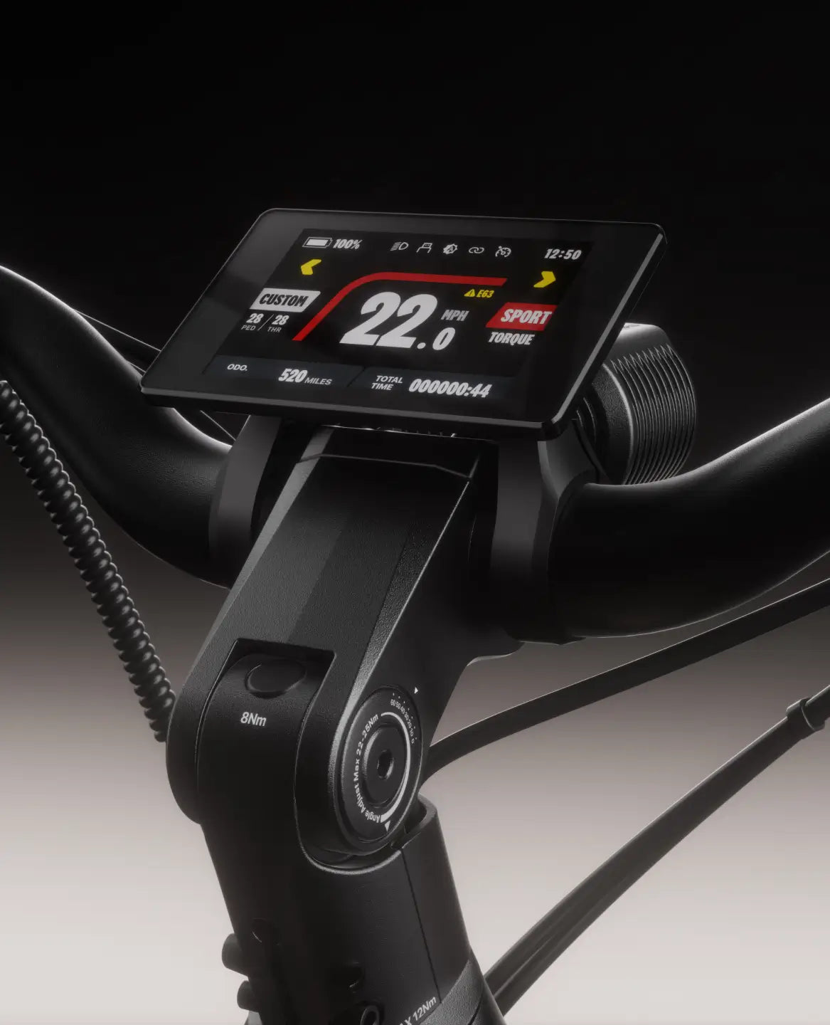 A close-up of the Velotric Discover M handlebar’s digital display shows speed, battery, time, mode, and torque—ideal for any comfort commuter or mid-drive electric bike fan.