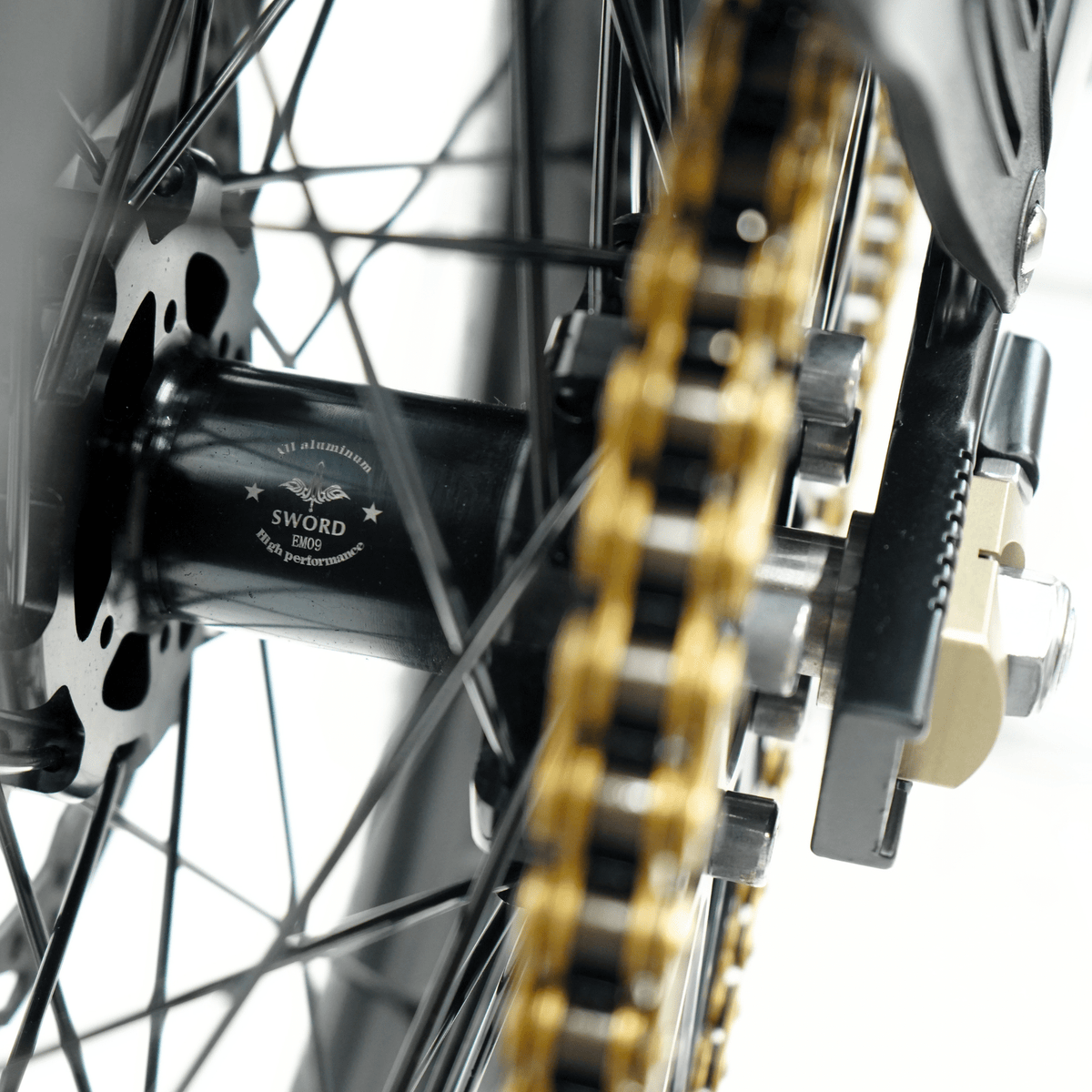 Ventus V1+ EVO electric dirt bike, rear chain and sprocket close-up