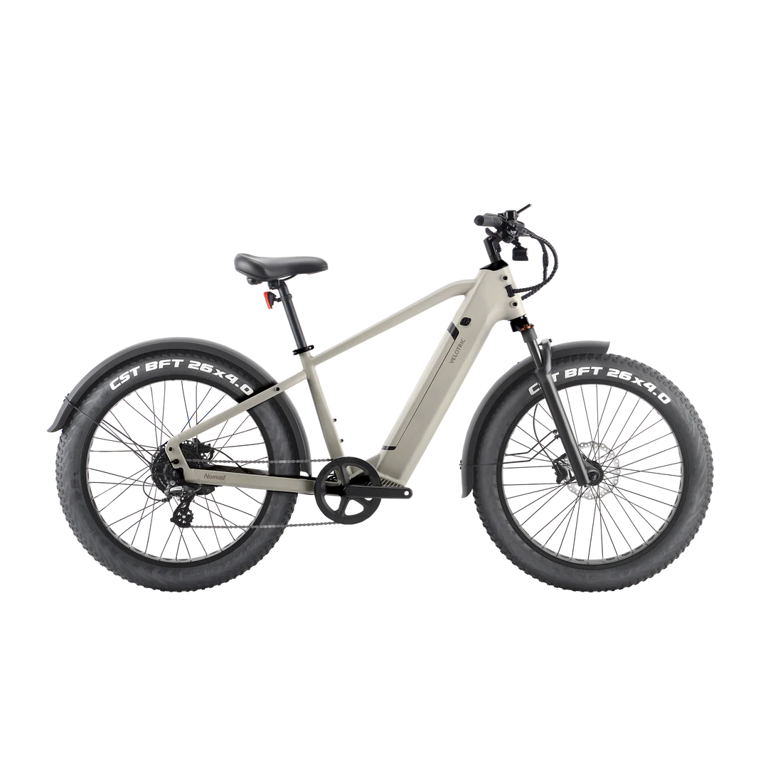 The Velotric - Nomad 1 - High Step - Sand electric bike is shown against a black background.